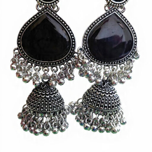Woman wearing black stone silver jhumka earrings with intricate oxidised silver detailing
