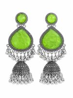 Woman wearing light green stone silver jhumka earrings with intricate oxidised silver detailing